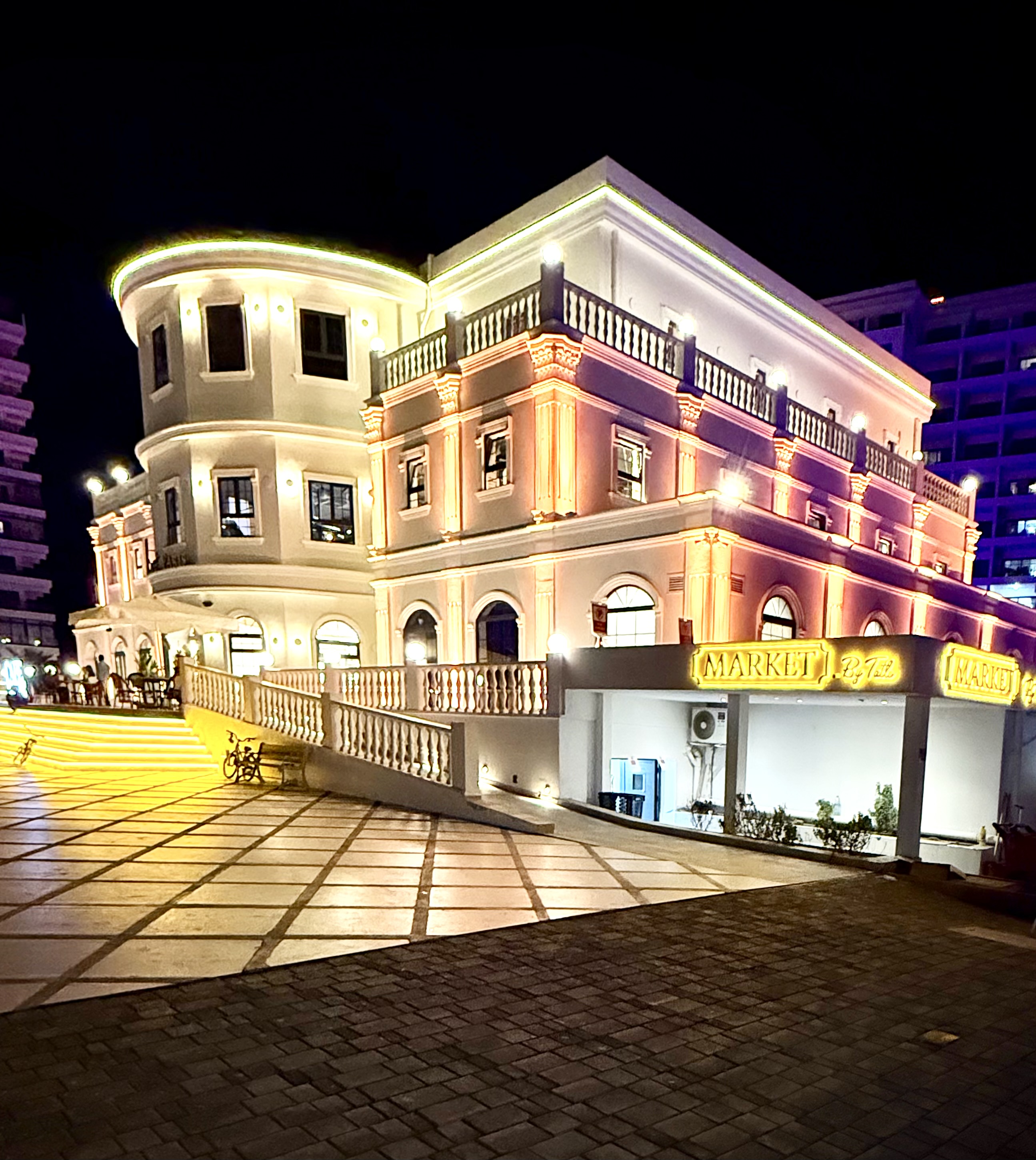 Resort palace facade illuminated at night