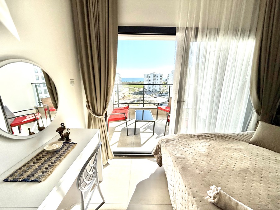 Bedroom with balcony view