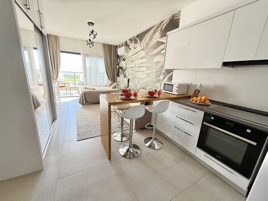 Open-plan kitchen and living area with sea view