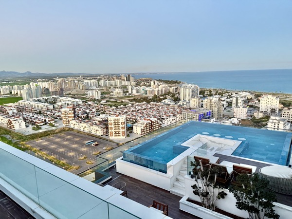 Rooftop pool with sea and city view