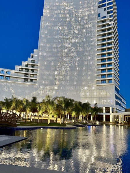 Resort tower glowing at dusk