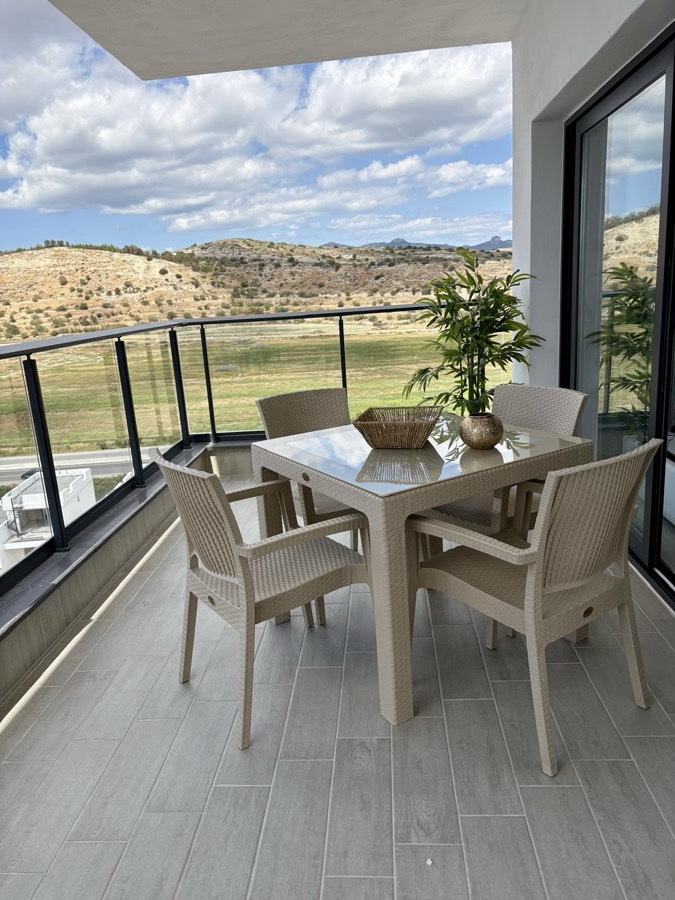 Terrace with dining set and mountain view