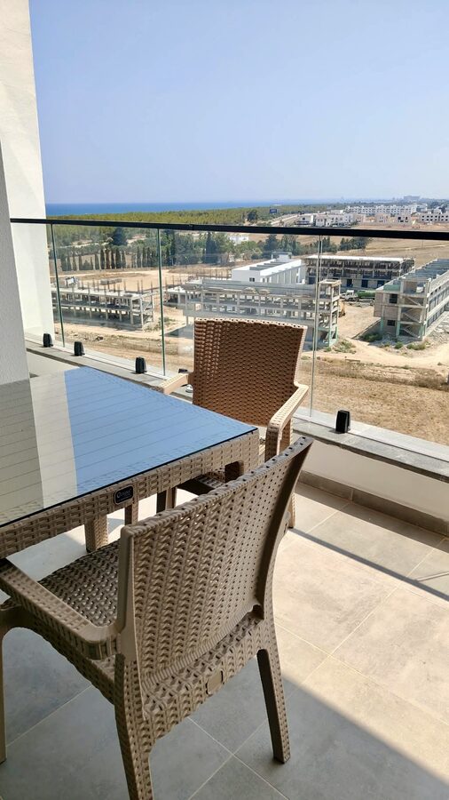 Private balcony with outdoor seating and sea view